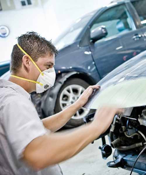 certified auto body shop tech working