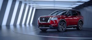 Red-Nissan-SUV-sitting-under-lights-Nissan-Certified-Collision-Repair-Dingmans-Collision-Center