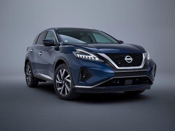 dark-blue-nissan-showroom-Dingmans-Collision-Center silver-2025-Cadillac-CTV-showroom-setting-GM-Certified-Collision-Repair