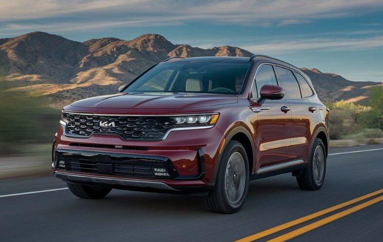 red-kia-driving-Dingmans-Collision-Center red-kia-driving-Dingmans-Collision-Center